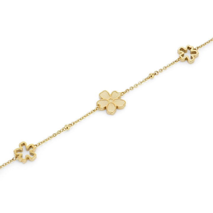 Niche Jewellery Olivia Burton gold-plated bracelet featuring delicate forget-me-not flower charms on a fine chain.