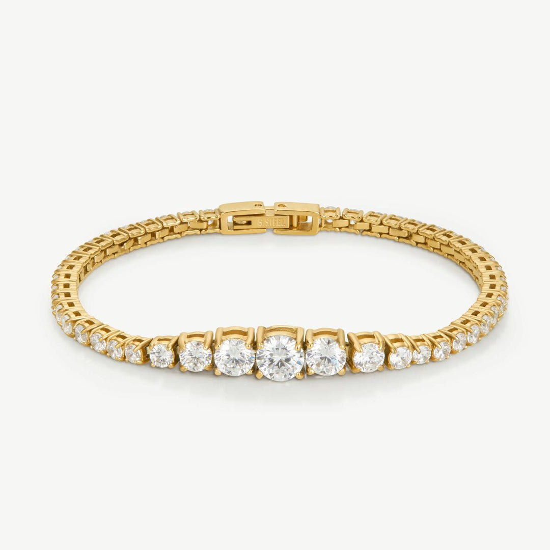 Niche Jewellery D.Louise gold graduated tennis bracelet with sparkling stones increasing in size towards the center