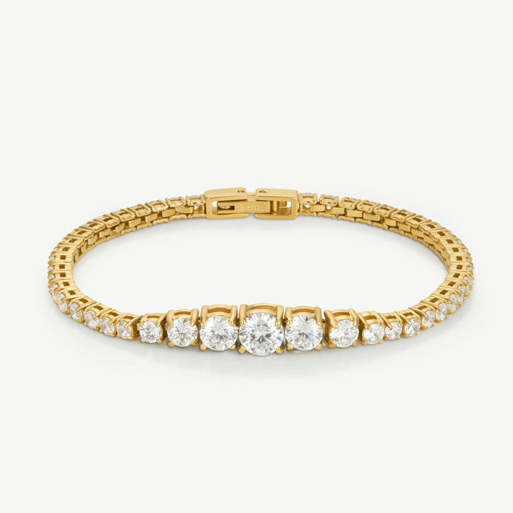 Niche Jewellery D.Louise gold graduated tennis bracelet with sparkling stones increasing in size towards the center