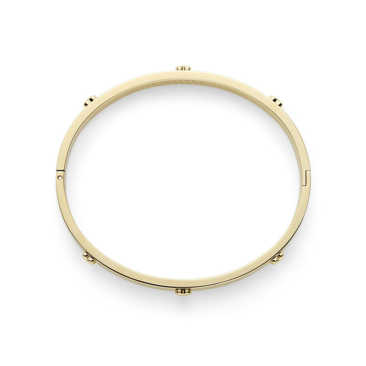 Niche Jewellery Olivia Burton gold-plated bangle featuring a delicate mini heart charm on a smooth circular band.