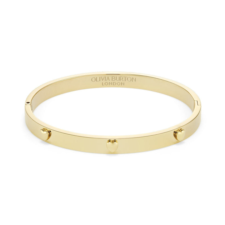 Niche Jewellery Olivia Burton gold-plated bangle featuring delicate mini heart charms on a smooth polished band.