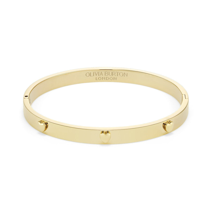 Niche Jewellery Olivia Burton gold-plated bangle featuring delicate mini heart charms on a smooth polished band.