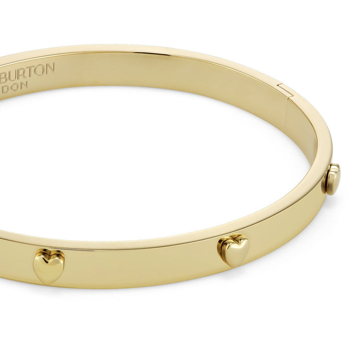 Niche Jewellery Olivia Burton gold-plated bangle featuring delicate mini heart charms on a smooth polished band.