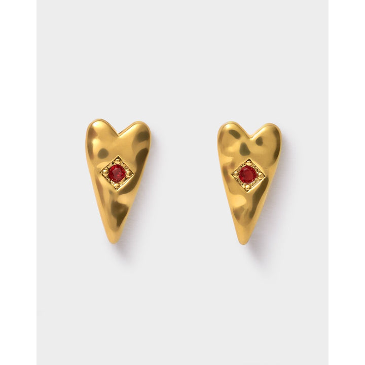 Niche Jewellery Katie Loxton gold-tone heart earrings featuring a deep red stone center, waterproof design.
