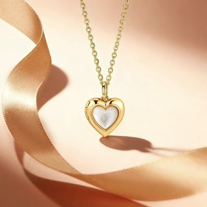 Niche Jewellery Ania Haie gold heart locket necklace with mother of pearl inlay on a delicate chain.