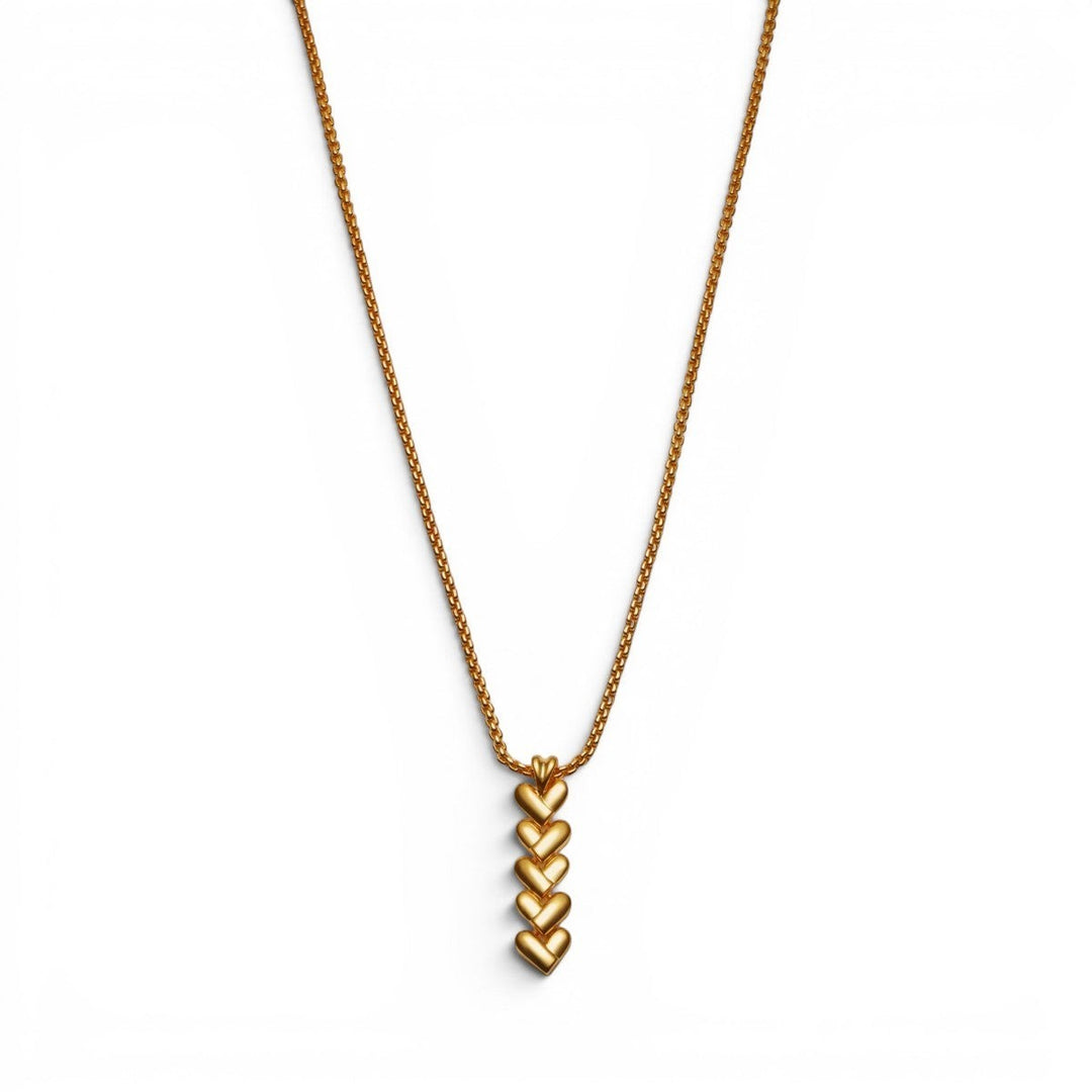 Niche Jewellery Katie Loxton gold necklace with a vertical row of five heart-shaped links on a delicate chain. Waterproof and sweat-proof.
