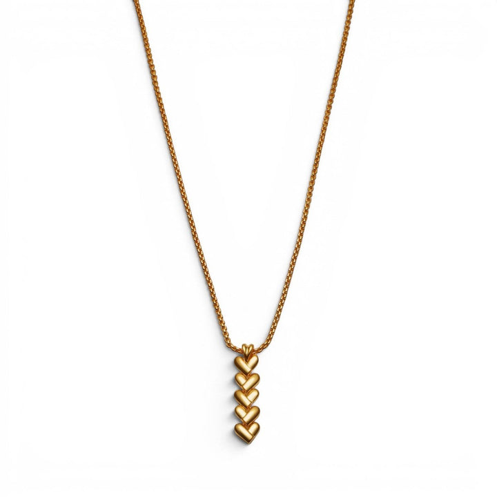 Niche Jewellery Katie Loxton gold necklace with a vertical row of five heart-shaped links on a delicate chain. Waterproof and sweat-proof.