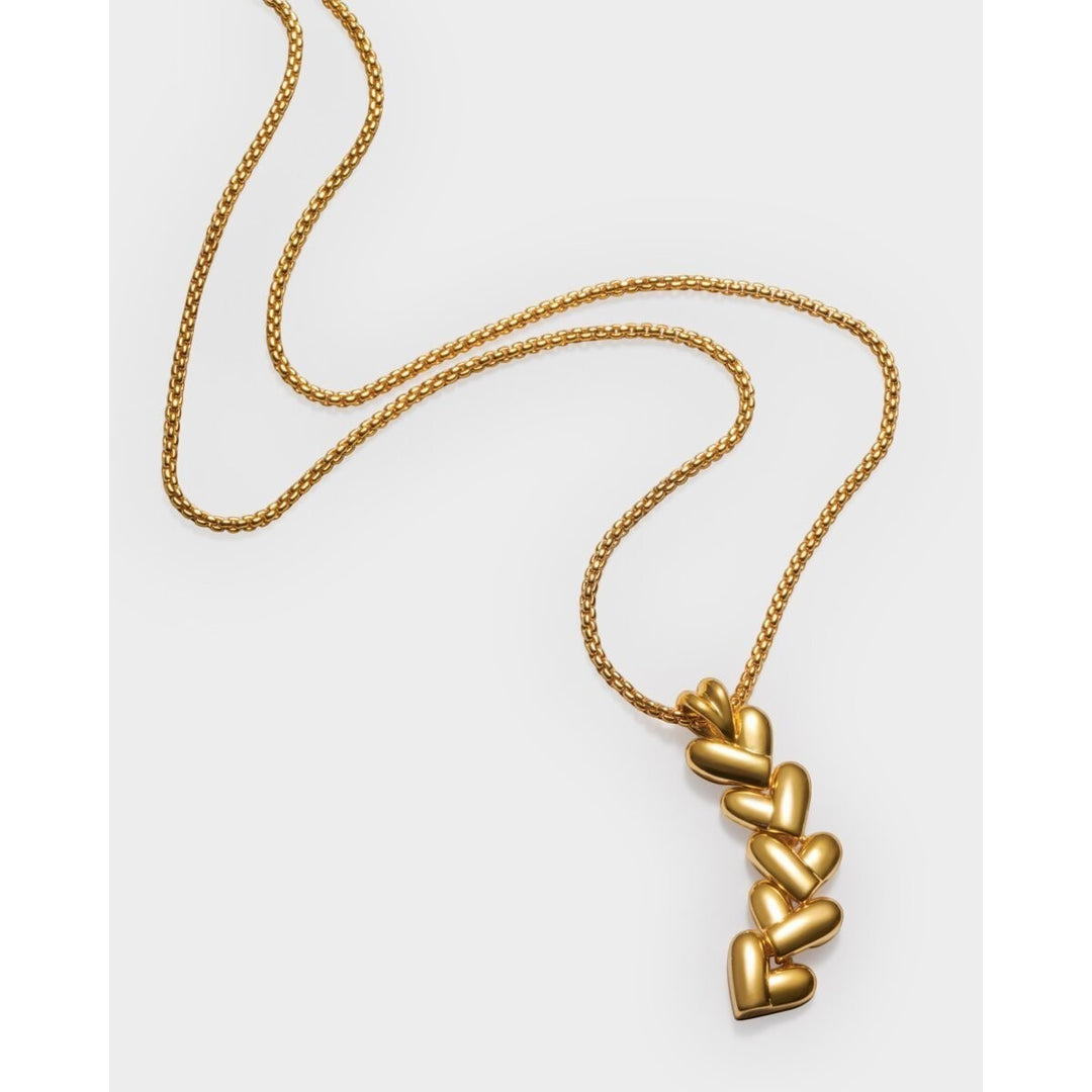 Niche Jewellery Katie Loxton gold necklace with a vertical row of five heart-shaped links on a delicate chain. Waterproof and sweat-proof.