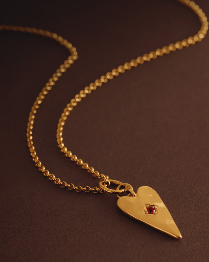 Niche Jewellery Katie Loxton gold-tone heart necklace with a deep red stone accent on a fine chain