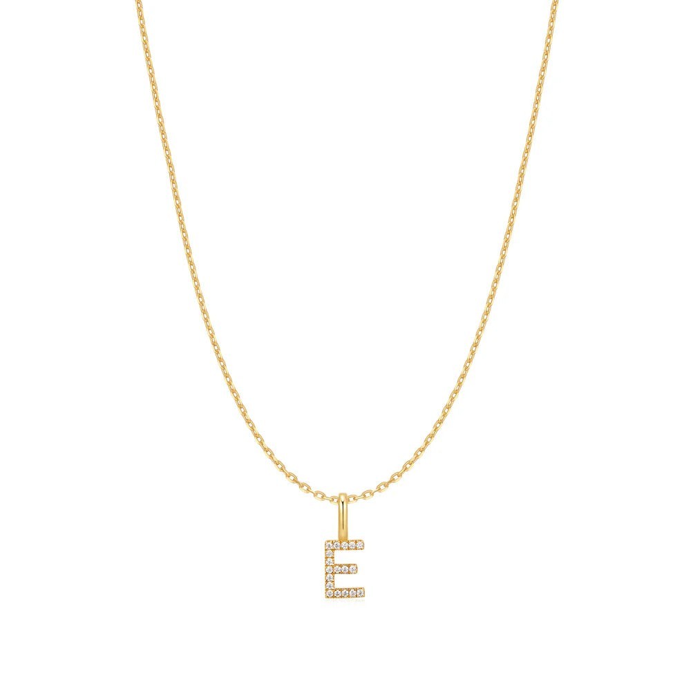 Niche Jewellery Ania Haie gold-plated initial E pendant necklace with delicate sparkling stones on a fine chain.