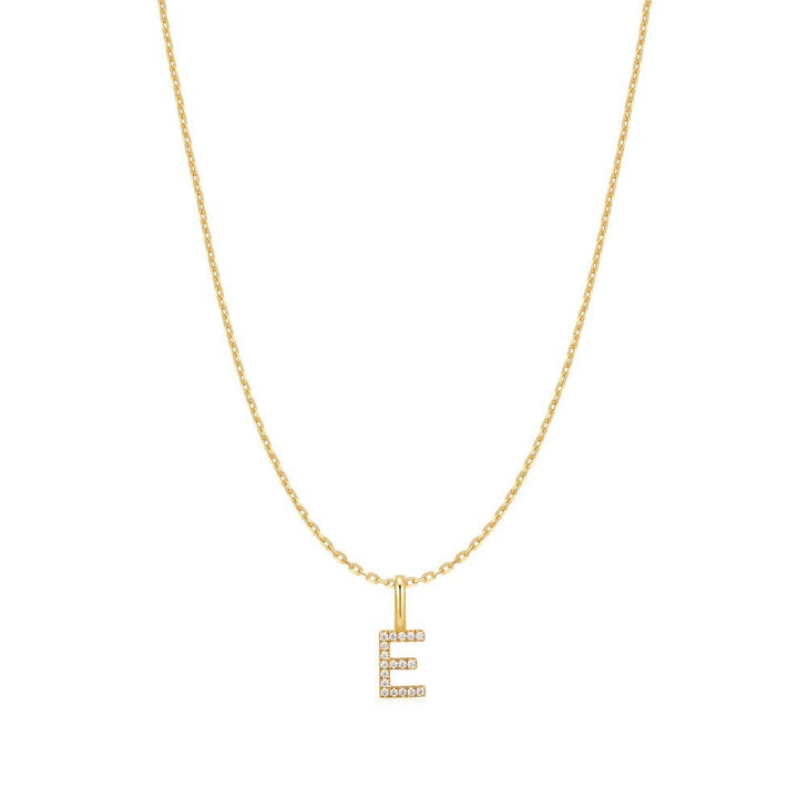 Niche Jewellery Ania Haie gold-plated initial E pendant necklace with delicate sparkling stones on a fine chain.