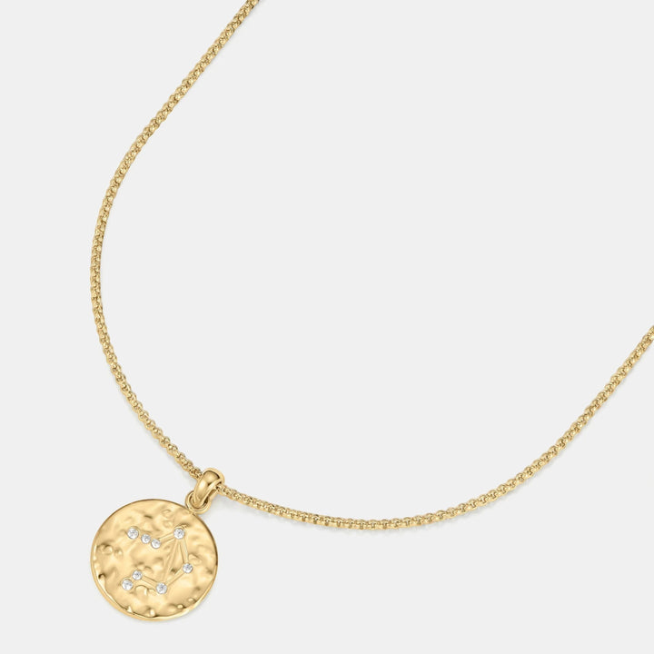 DLouise gold Libra zodiac talisman necklace with hammered finish and clear crystal accents.