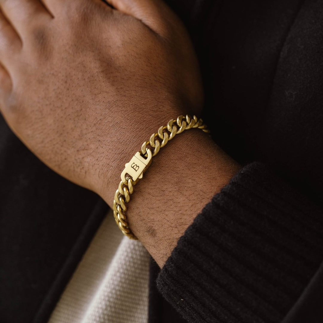 Niche Jewellery Steel & Barnett 18K gold plated stainless steel link chain bracelet with branded clasp on wrist