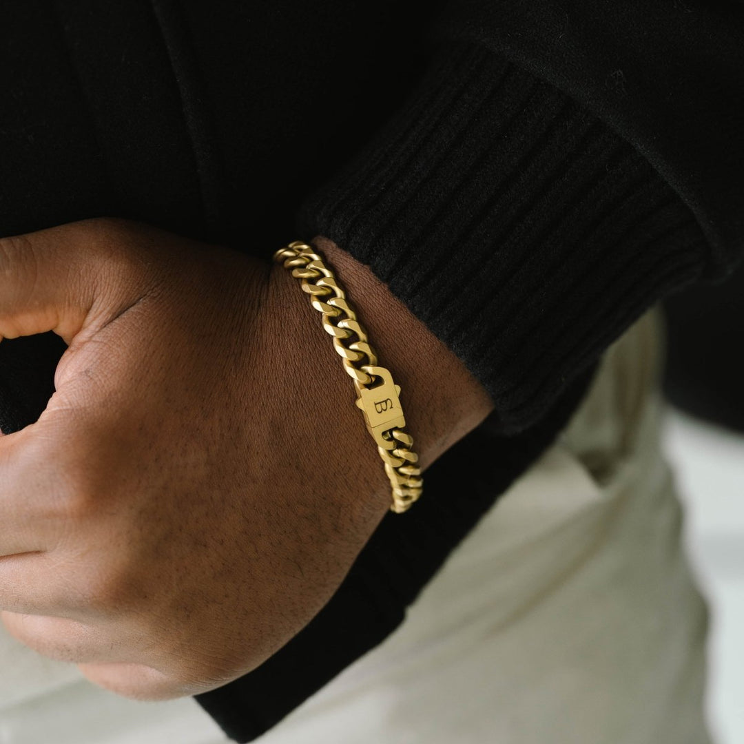 Niche Jewellery Steel & Barnett 18K gold plated stainless steel link chain bracelet with branded clasp on wrist