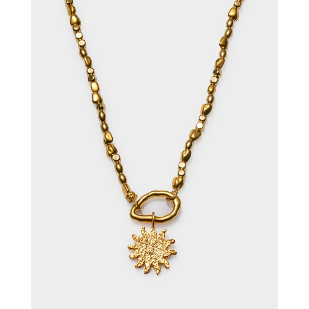 Niche Jewellery Golden Solesi waterproof gold necklace with sun pendant and textured beads. 18K gold PVD coating.