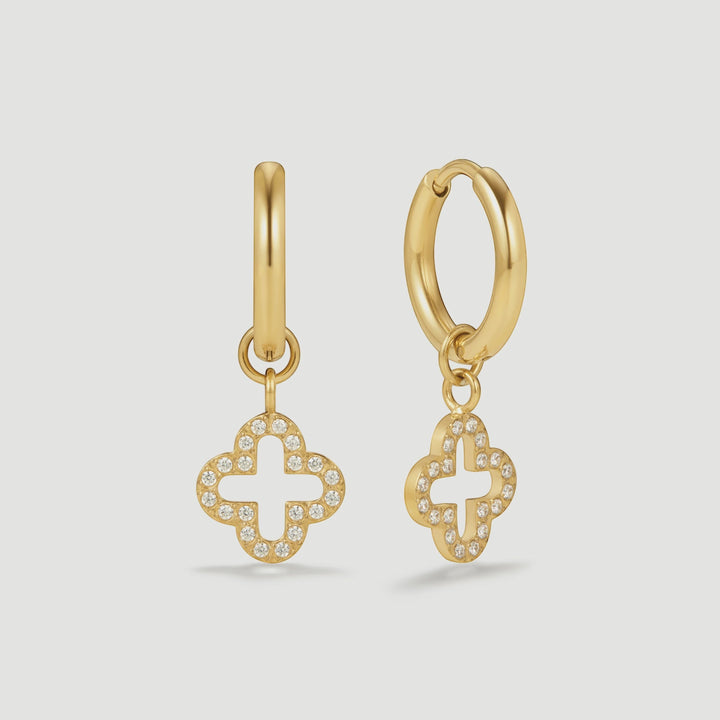 Niche Jewellery D.Louise gold huggie hoop earrings featuring a sparkling pave clover charm in stainless steel