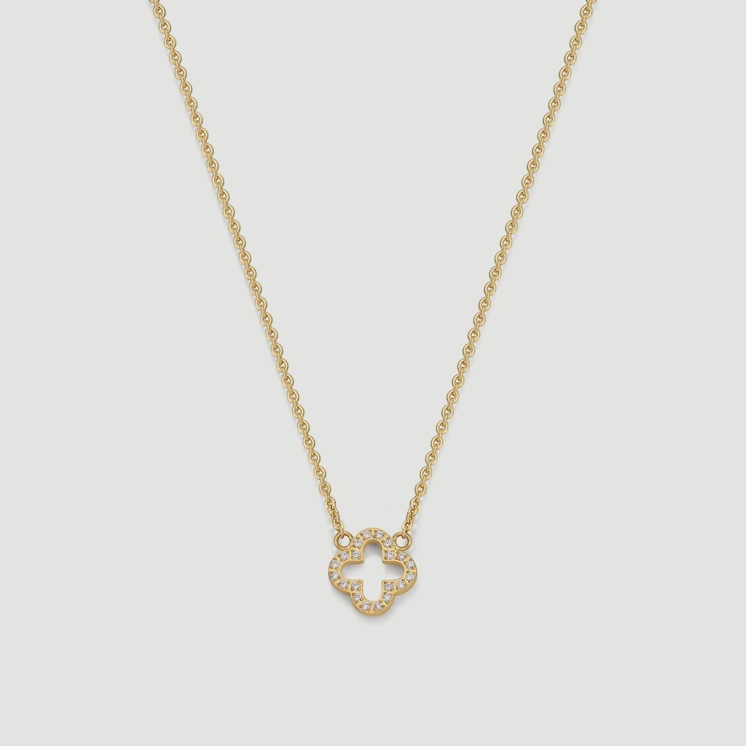 Niche Jewellery D.Louise gold clover pendant necklace with pavé crystal detailing on a delicate chain.