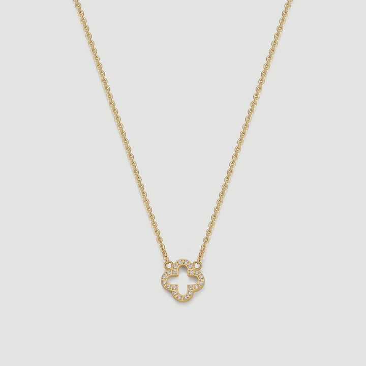 Niche Jewellery D.Louise gold clover pendant necklace with pavé crystal detailing on a delicate chain.
