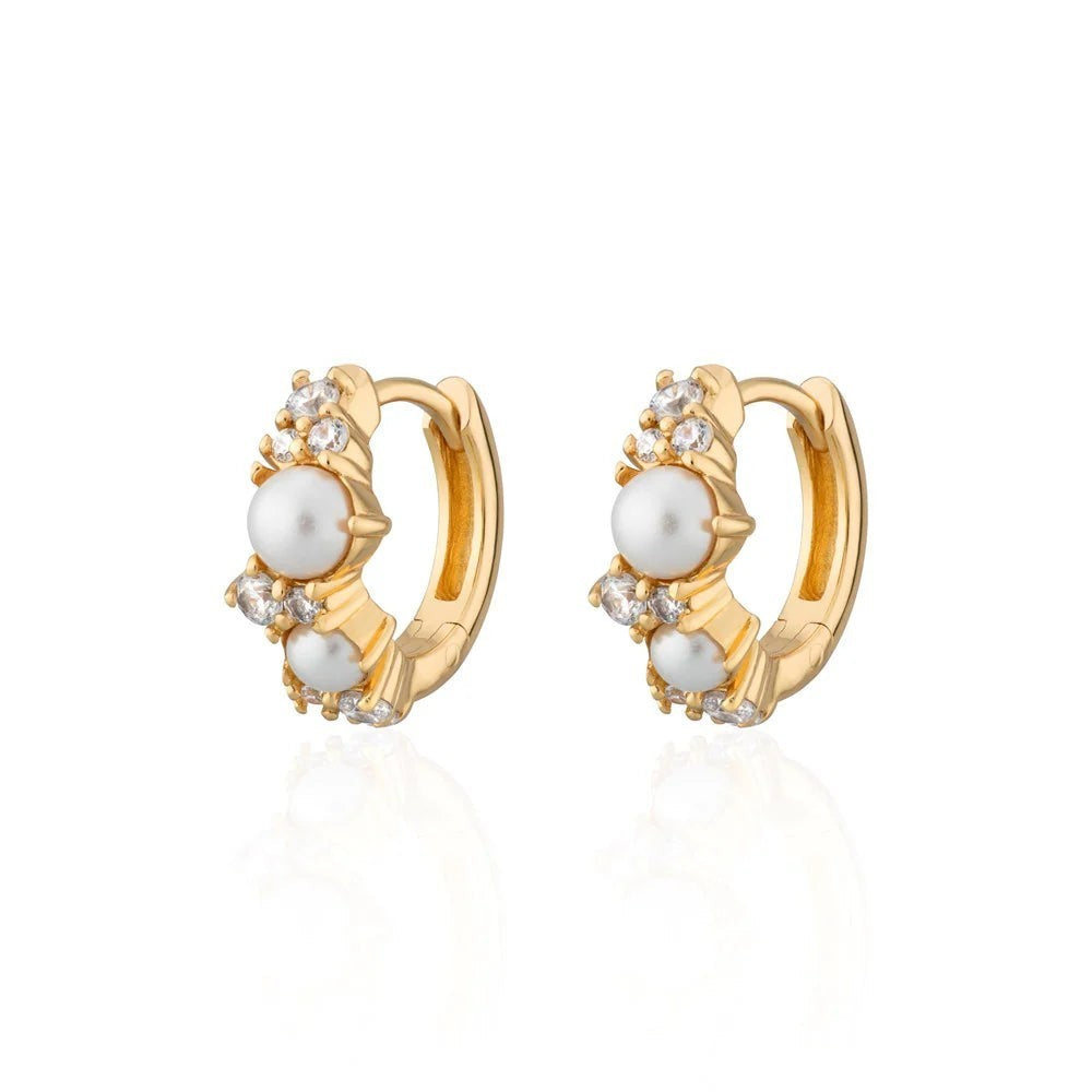 Niche Jewellery Scream Pretty Hannah Martin gold-plated huggie earrings with lustrous pearls and sparkling crystals.