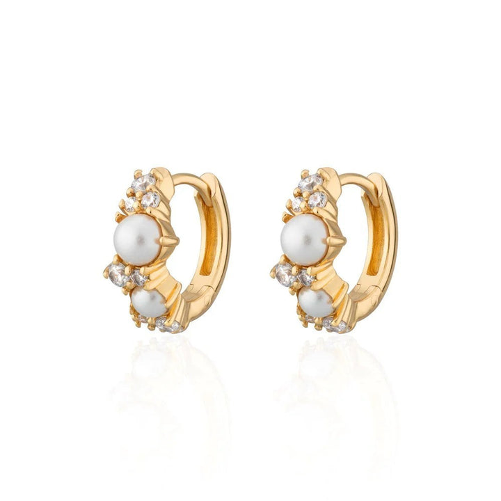 Niche Jewellery Scream Pretty Hannah Martin gold-plated huggie earrings with lustrous pearls and sparkling crystals.