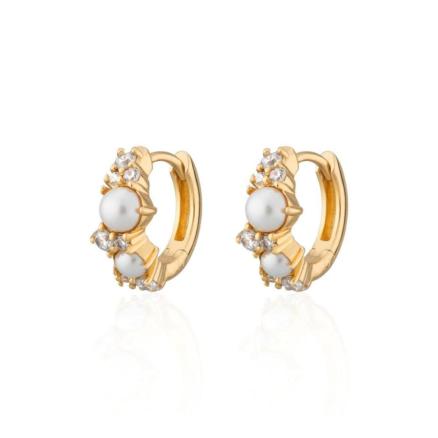 Niche Jewellery Scream Pretty Hannah Martin gold-plated huggie earrings with lustrous pearls and sparkling crystals.