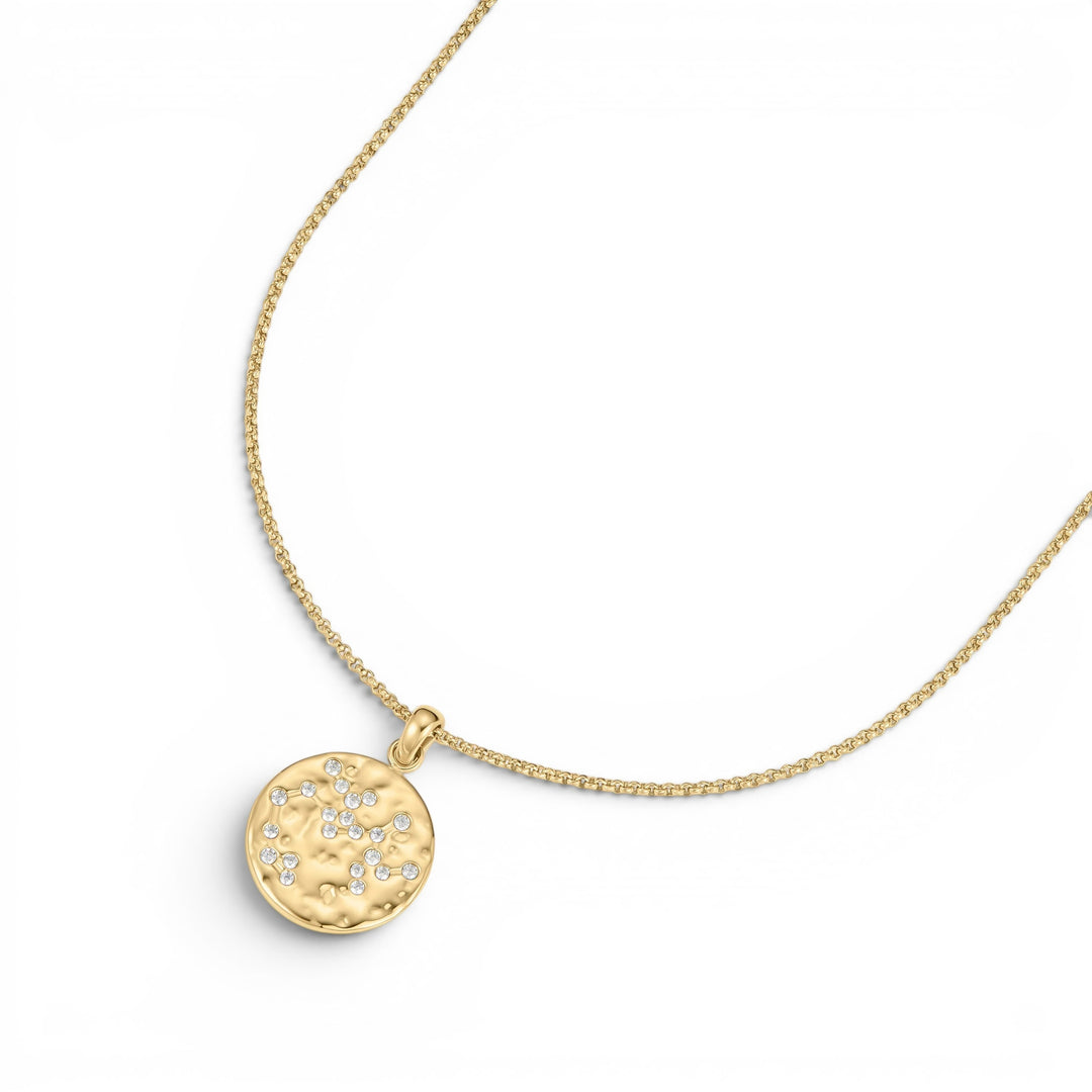Niche Jewellery gold Sagittarius zodiac talisman necklace with hammered finish and clear crystals.