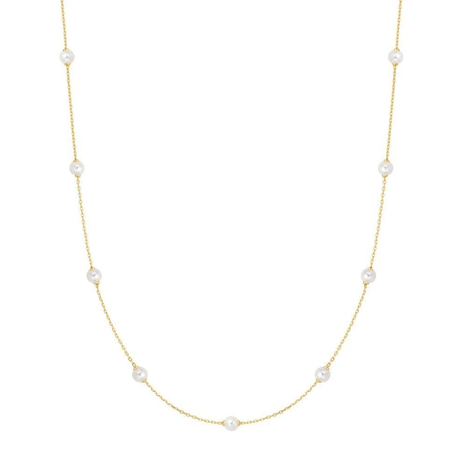 Niche Jewellery Ania Haie gold-plated chain necklace featuring spaced white shell pearls for an elegant layered look.