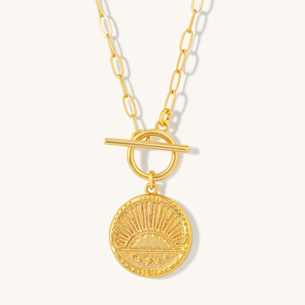 Niche Jewellery gold plated sterling silver rising sun pendant necklace with a toggle clasp on a delicate chain.