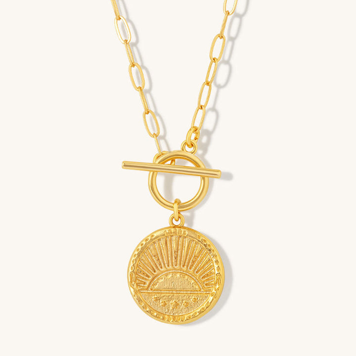 Niche Jewellery gold plated sterling silver rising sun pendant necklace with a toggle clasp on a delicate chain.