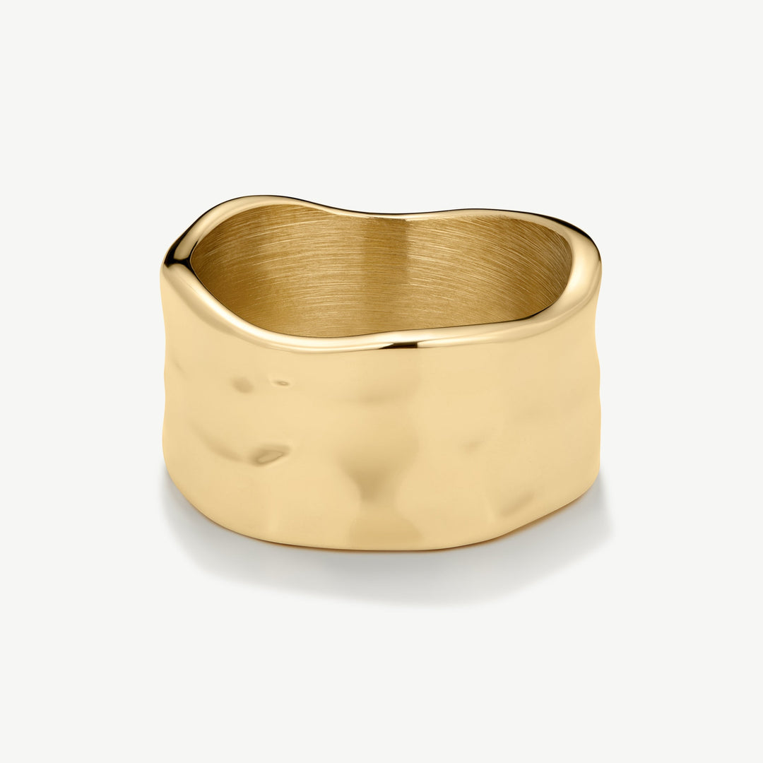 Niche Jewellery gold band ring with a hammered texture and organic shape. Waterproof stainless steel.