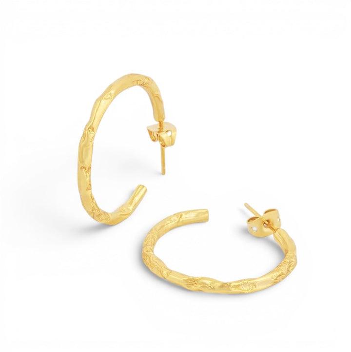 Niche Jewellery gold plated sterling silver hoop earrings with a textured molten magma design.