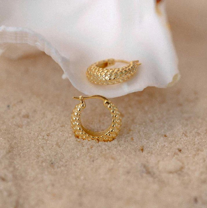 Niche Jewellery Shore hoop earrings in 18k gold plated sterling silver with textured hand-carved rock-like detail.