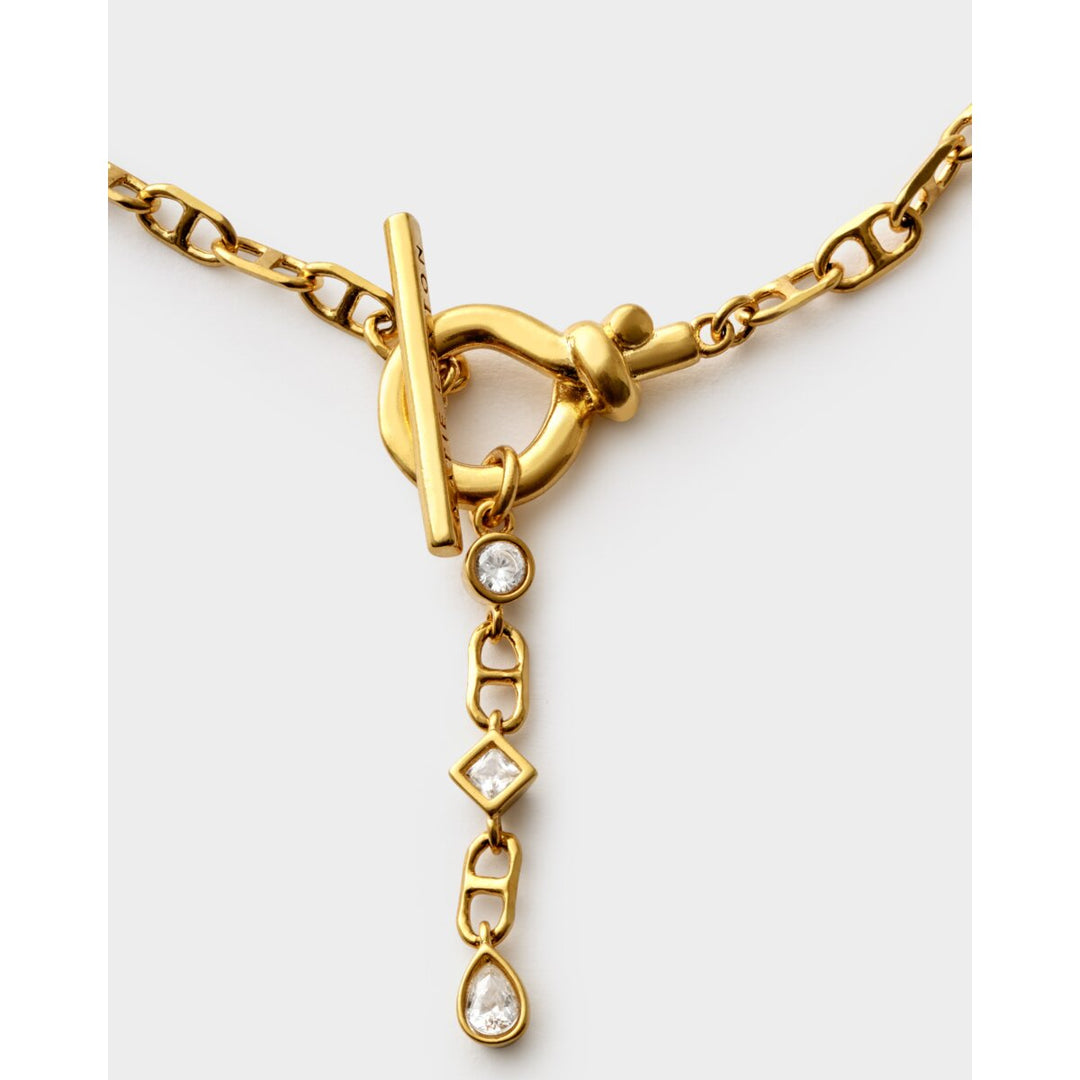 Niche Jewellery Katie Loxton gold-tone waterproof bracelet with a toggle clasp and dangling crystal charms.