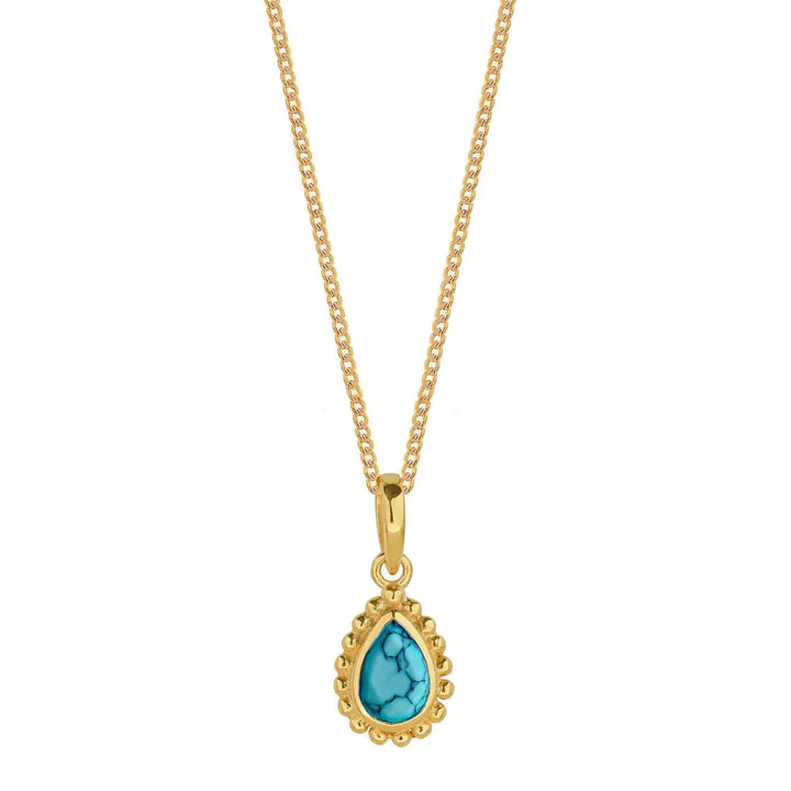 Niche Jewellery gold-plated necklace featuring a pear-shaped turquoise birthstone in a handcrafted beaded setting.
