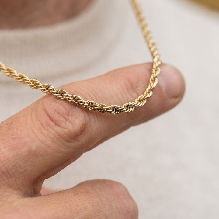 Niche Jewellery Steel & Barnett 18K gold plated stainless steel twisted rope chain necklace worn on a finger