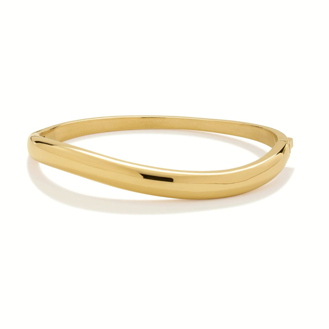 Niche Jewellery gold wave bangle with a smooth, polished finish. Designed for everyday wear, water and tarnish resistant.
