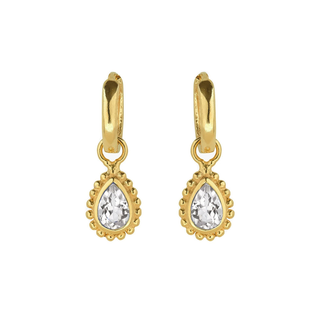 Niche Jewellery Charlotte's Web gold huggie hoops with pear-cut white topaz in a beaded Rawa style setting.