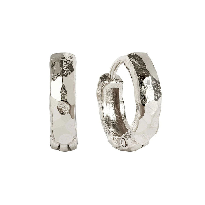 Niche Jewellery Charlotte's Web Lakshmi hammered sterling silver huggie hoop earrings with a textured finish.