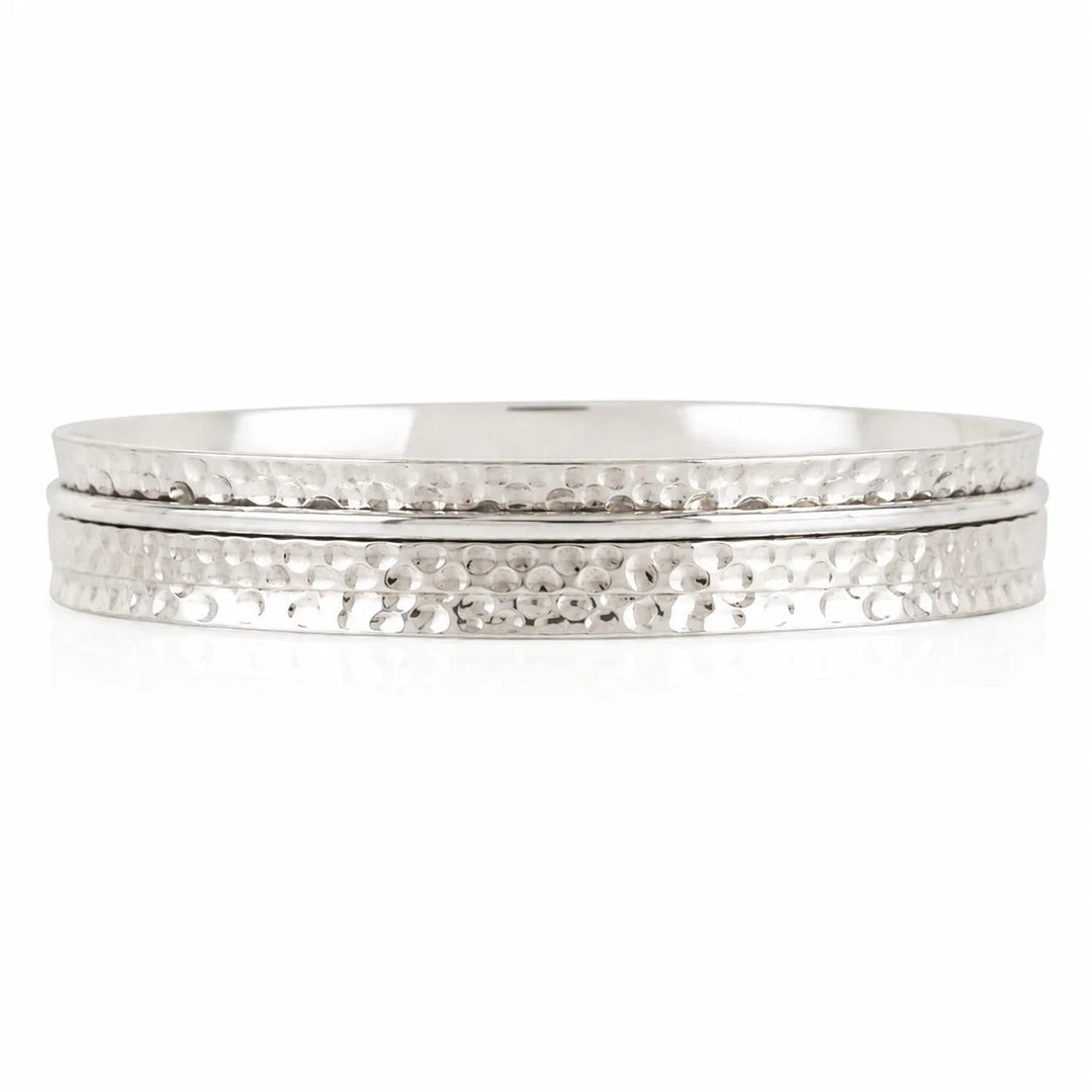 Niche Jewellery Charlotte's Web Karma Abundance spinning bangle in recycled hammered sterling silver.