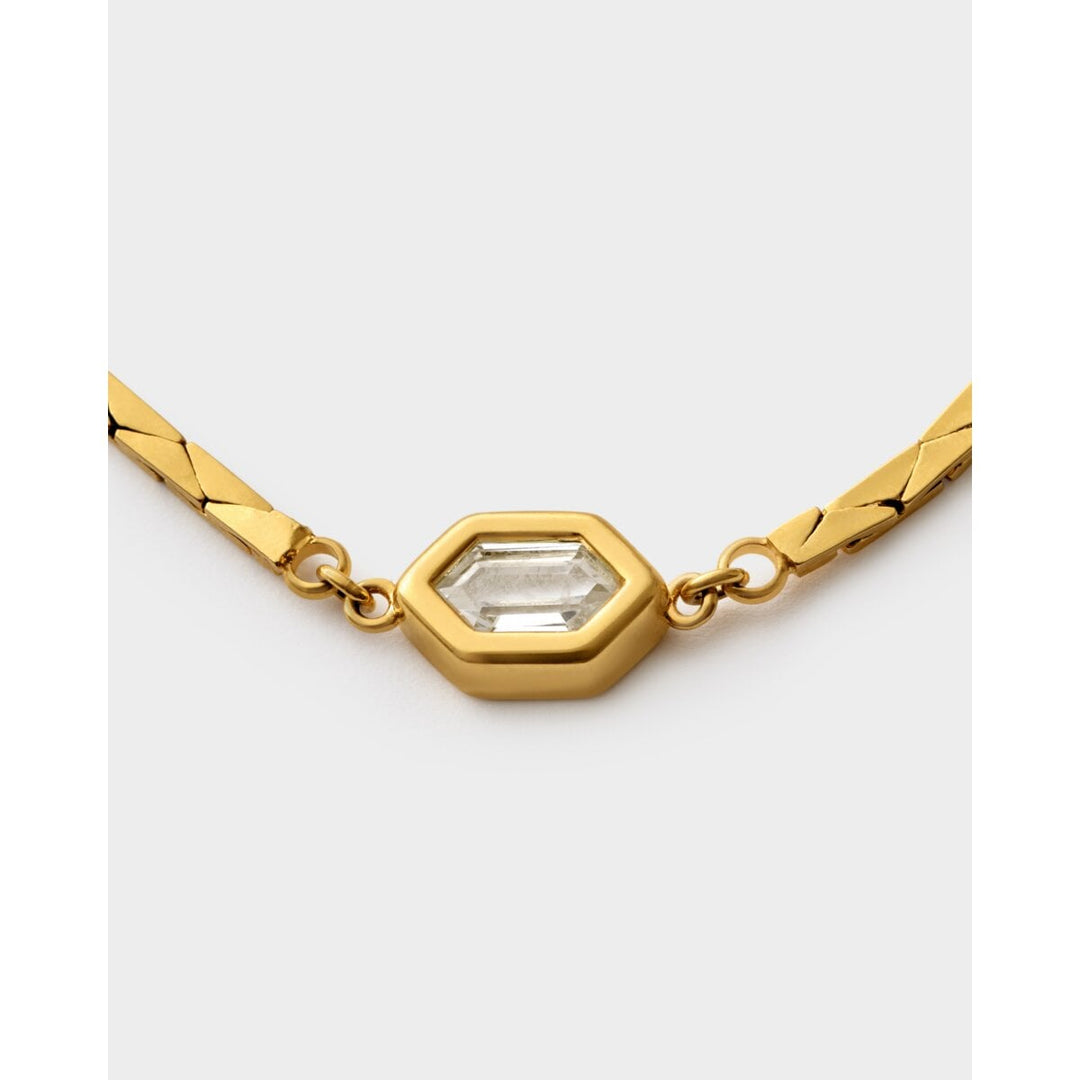 Niche Jewellery Katie Loxton Harlequin waterproof gold bracelet featuring a central hexagonal crystal charm.
