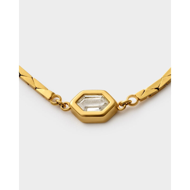Niche Jewellery Katie Loxton Harlequin waterproof gold bracelet featuring a central hexagonal crystal charm.