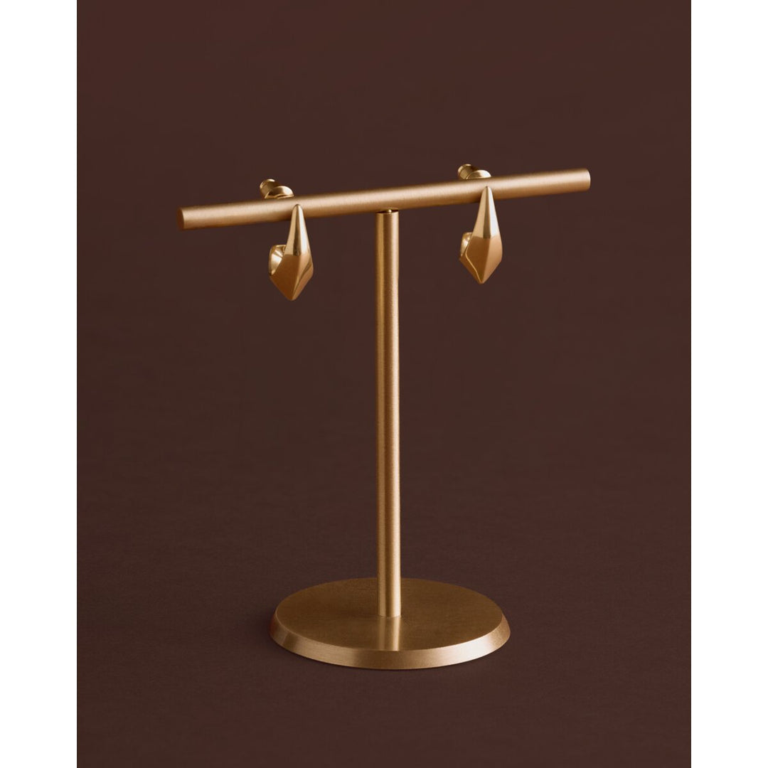 Niche Jewellery Katie Loxton Harlequin waterproof gold hoop earrings with a diamond-check pattern on a display stand.