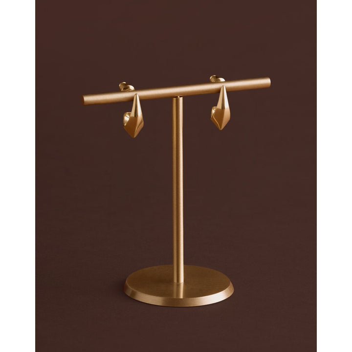 Niche Jewellery Katie Loxton Harlequin waterproof gold hoop earrings with a diamond-check pattern on a display stand.
