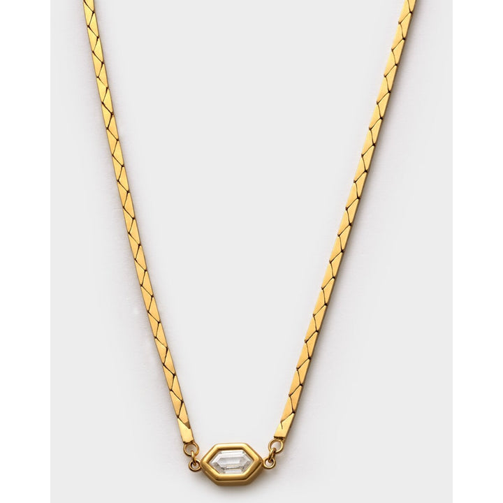 Niche Jewellery Katie Loxton Harlequin gold-tone waterproof necklace with a diamond-check pendant on a flat chain.
