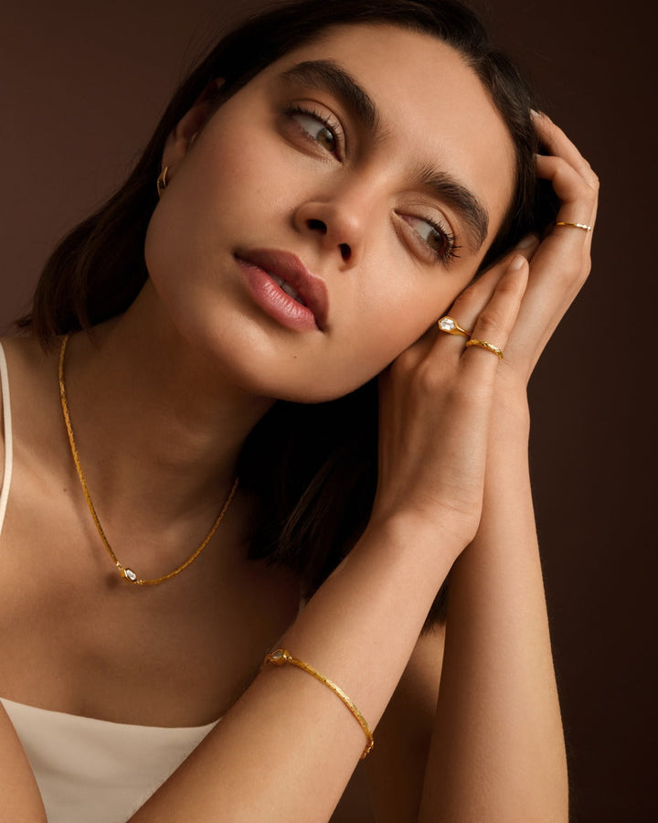 Niche Jewellery Katie Loxton Harlequin waterproof gold statement ring with a diamond-check pattern on a model
