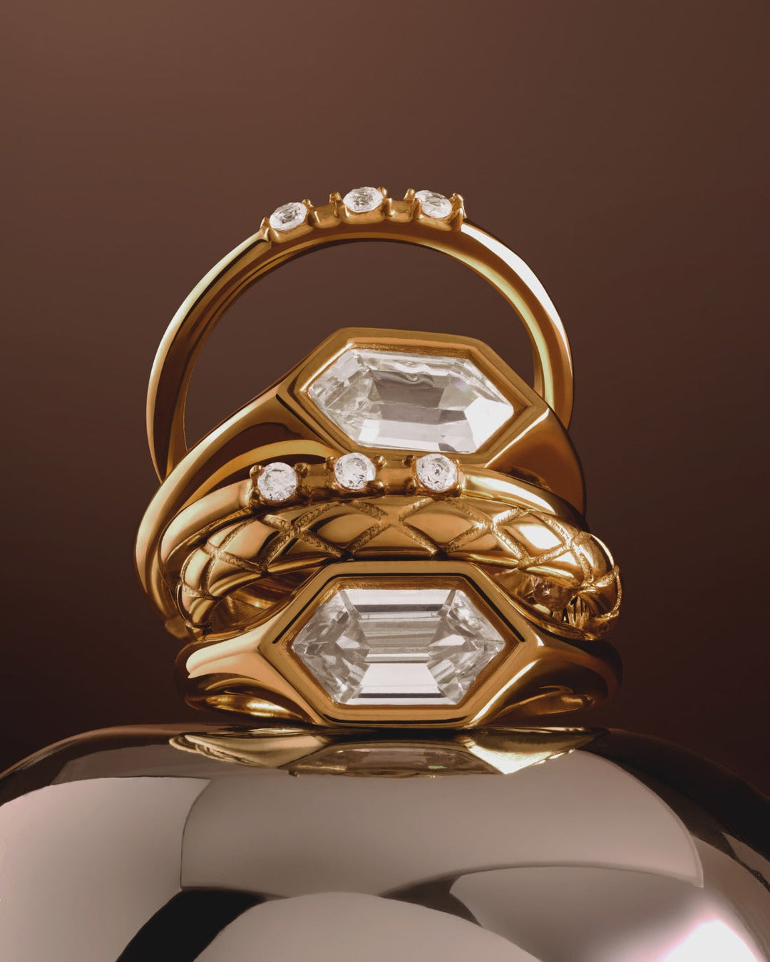 Niche Jewellery Katie Loxton Harlequin waterproof gold statement ring with diamond-check pattern in a stacked display