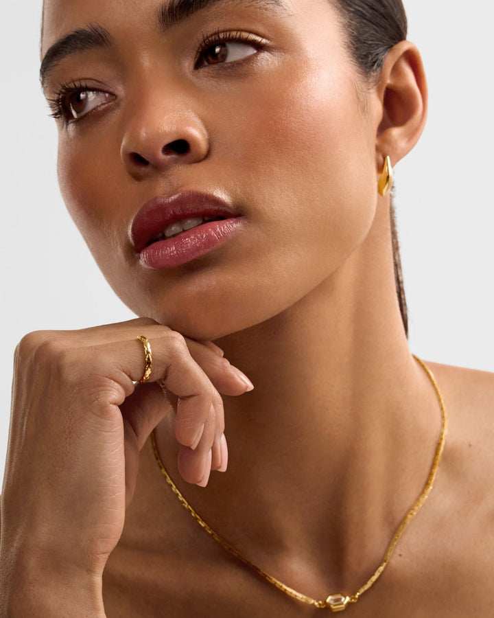 Niche Jewellery Katie Loxton Harlequin waterproof gold ring with diamond-check pattern worn on a model's finger