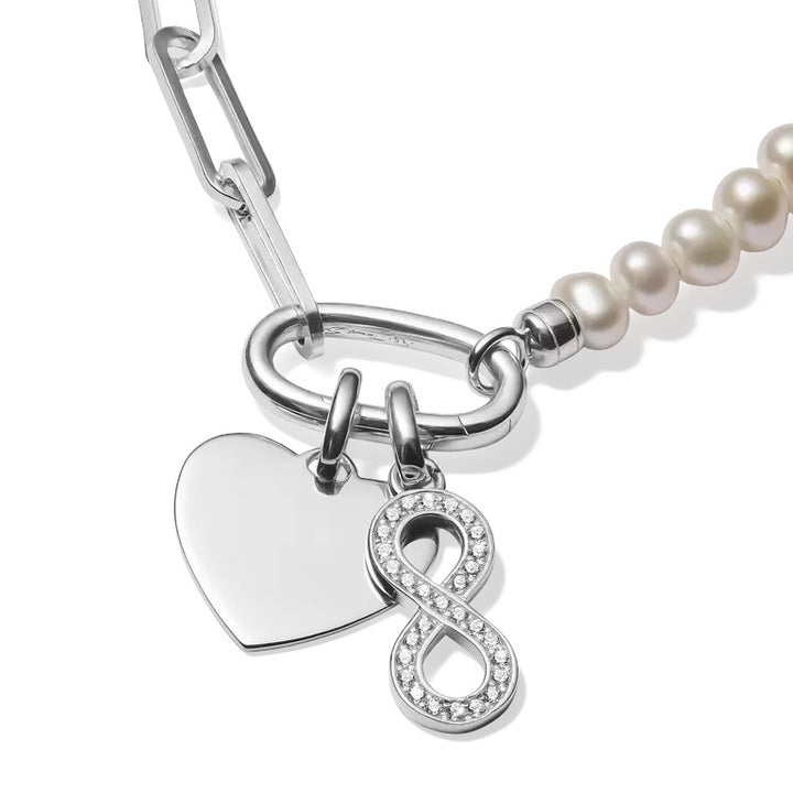 Niche Jewellery sterling silver infinity charm pendant with white zirconia stones and a heart charm.
