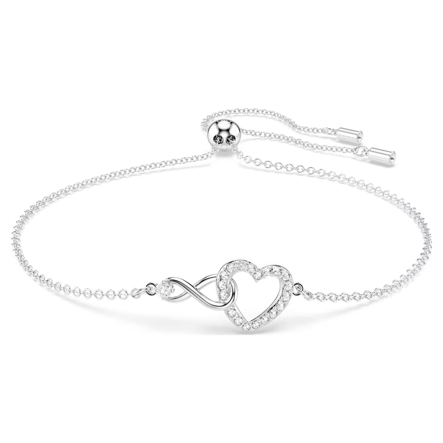 Niche Jewellery Swarovski Infinity Heart bracelet in rhodium-plated silver with sparkling white crystals.
