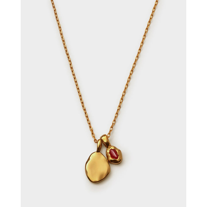 Niche Jewellery Katie Loxton January birthstone necklace featuring a gold-tone chain and deep red garnet pendant.